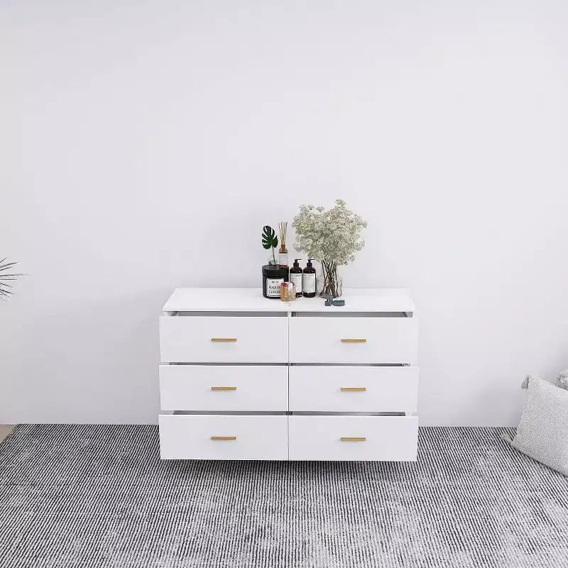 Commode à 6 tiroirs Okak avec poignées dorées et pieds en acier, grands tiroirs spacieux, meuble de rangement élégant pour l'organisation de la maison