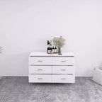 Commode à 6 tiroirs Okak avec poignées dorées et pieds en acier, grands tiroirs spacieux, meuble de rangement élégant pour l'organisation de la maison