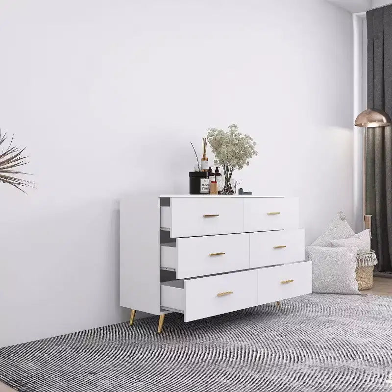 Commode à 6 tiroirs Okak avec poignées dorées et pieds en acier, grands tiroirs spacieux, meuble de rangement élégant pour l'organisation de la maison