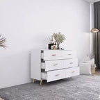 Commode à 6 tiroirs Okak avec poignées dorées et pieds en acier, grands tiroirs spacieux, meuble de rangement élégant pour l'organisation de la maison