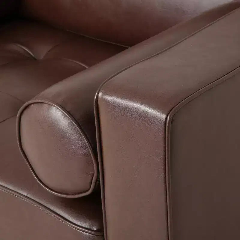 Fauteuil club capitonné contemporain en similicuir GDFStudio Hixon avec traversins