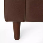 Fauteuil club capitonné contemporain en similicuir GDFStudio Hixon avec traversins