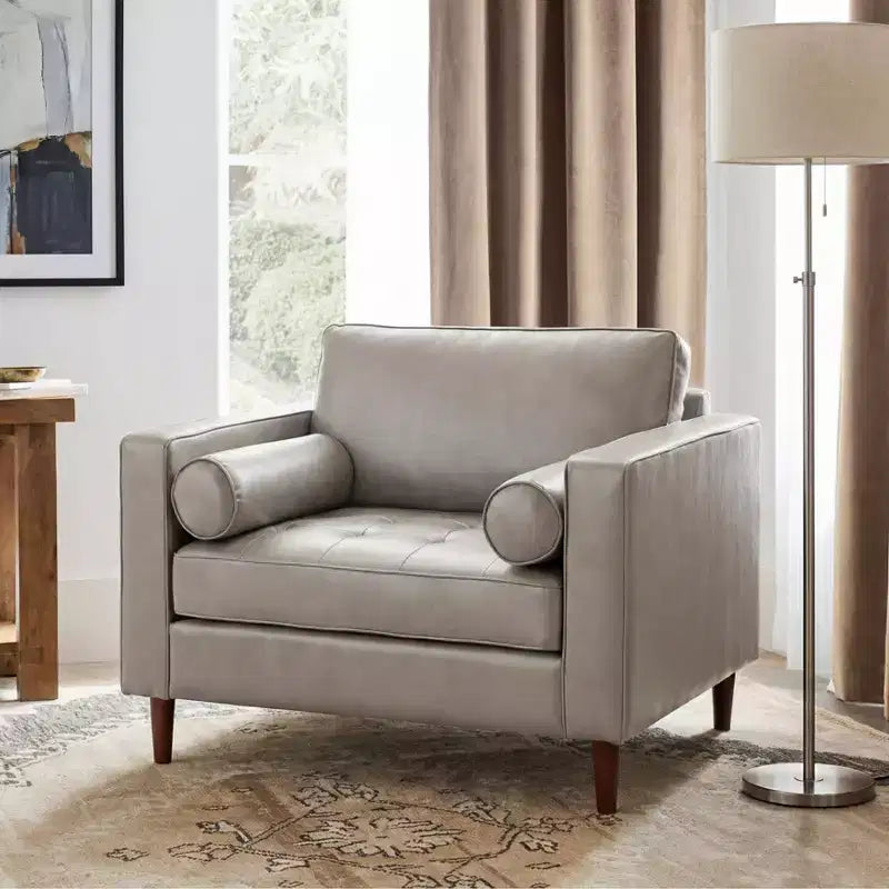 Fauteuil club capitonné contemporain en similicuir GDFStudio Hixon avec traversins
