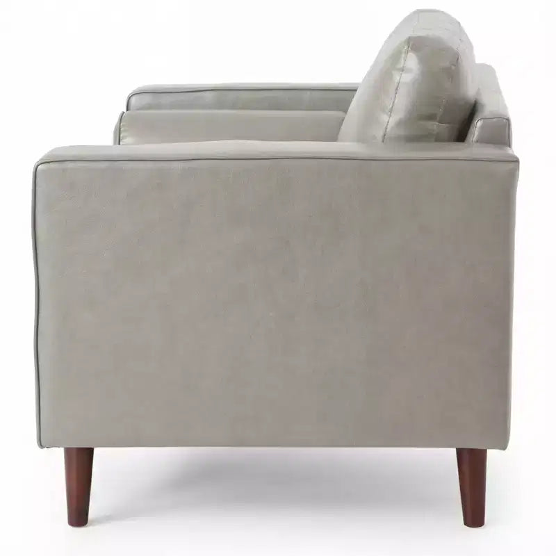 Fauteuil club capitonné contemporain en similicuir GDFStudio Hixon avec traversins