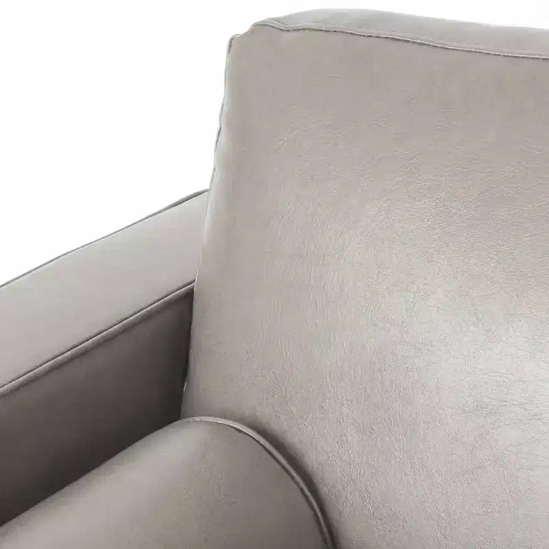 Fauteuil club capitonné contemporain en similicuir GDFStudio Hixon avec traversins