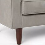 Fauteuil club capitonné contemporain en similicuir GDFStudio Hixon avec traversins