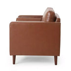 Fauteuil club capitonné contemporain en similicuir GDFStudio Hixon avec traversins
