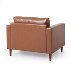 Fauteuil club capitonné contemporain en similicuir GDFStudio Hixon avec traversins