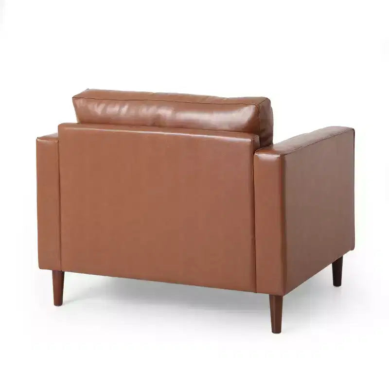 Fauteuil club capitonné contemporain en similicuir GDFStudio Hixon avec traversins
