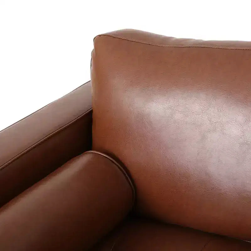 Fauteuil club capitonné contemporain en similicuir GDFStudio Hixon avec traversins