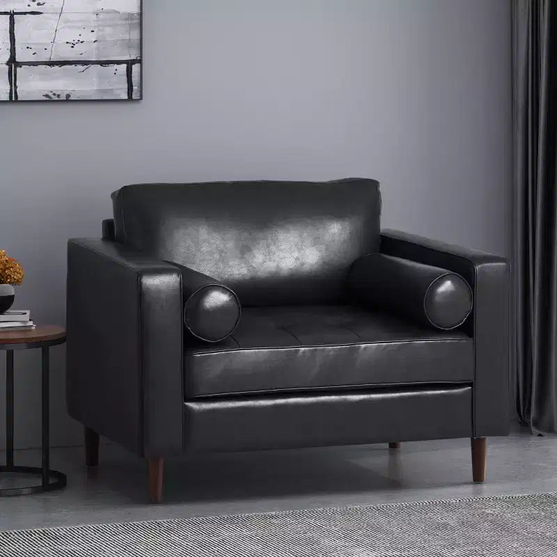 Fauteuil club capitonné contemporain en similicuir GDFStudio Hixon avec traversins