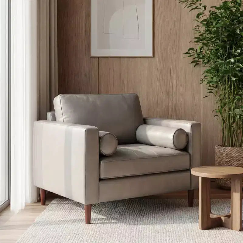 Fauteuil club capitonné contemporain en similicuir GDFStudio Hixon avec traversins