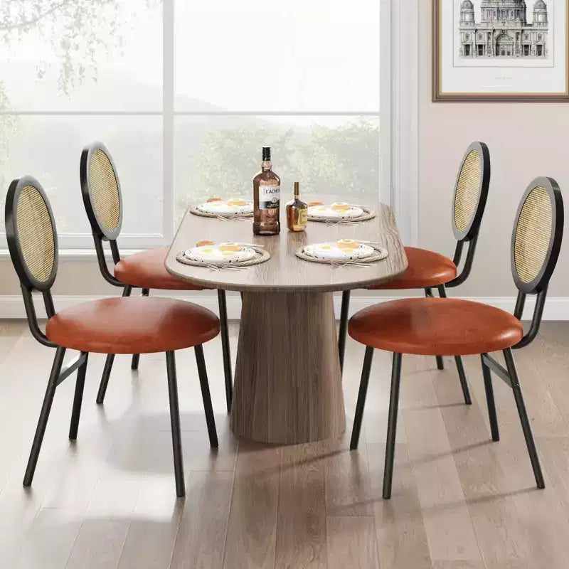 Lot de 4 chaises de salle à manger en rotin. Chaises de cuisine modernes rembourrées avec coussins épais et pieds en métal. Idéales pour les petits espaces.