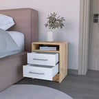 Cette table de chevet Cartiz à deux tiroirs, finition blanc/chêne clair, allie un style contemporain à des solutions de rangement intelligentes, créant ainsi un gain de place.