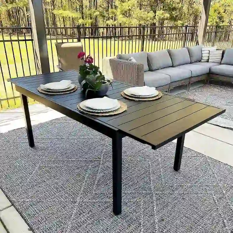 Ensemble de salle à manger 9 pièces, 1 table extensible en métal et 8 chaises en textilène à ressorts oscillants