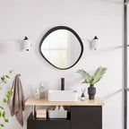 Miroir mural rond asymétrique contemporain Sonya de 61 cm avec cadre en fer noir en relief