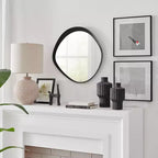 Miroir mural rond asymétrique contemporain Sonya de 61 cm avec cadre en fer noir en relief