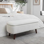 Banc de rangement Celia en tissu bouclé avec pieds en bois d'hévéa