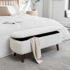 Banc de rangement Celia en tissu bouclé avec pieds en bois d'hévéa