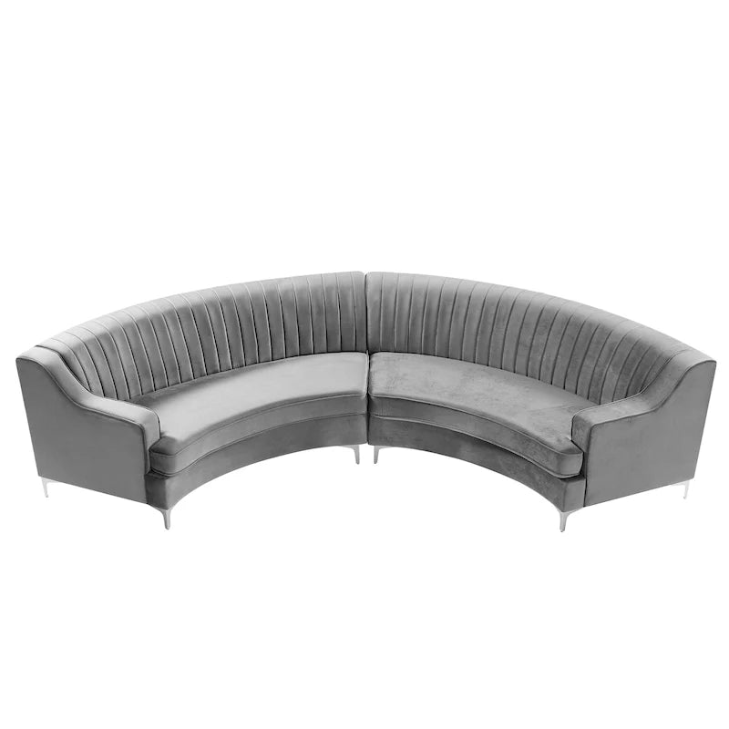 Canapé d'angle incurvé en velours capitonné avec coussins