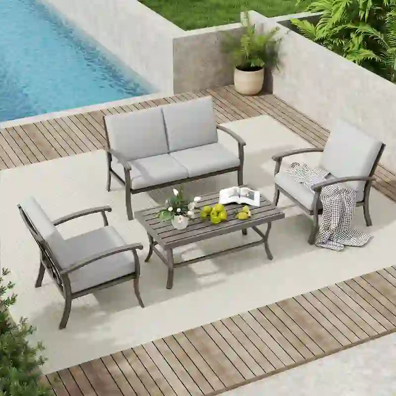 Ensemble de conversation en aluminium 4 places pour patio avec table basse, causeuse et coussins gris clair