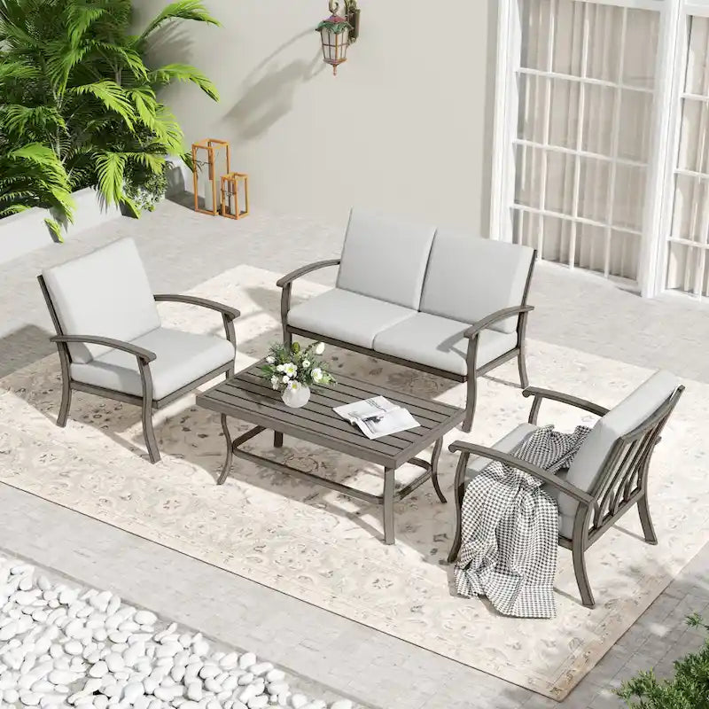 Ensemble de conversation en aluminium 4 places pour patio avec table basse, causeuse et coussins gris clair