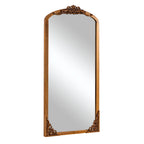 Miroir sur pied en bois massif sculpté en plein cintre