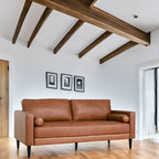 Canapé moderne en cuir véritable avec pieds en bois et coussin traversin supplémentaire